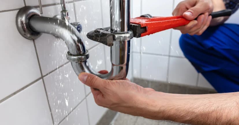Plumber repairing pipes